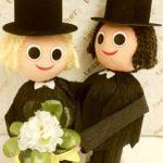 A couple of people that are in some kind of cake