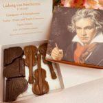 A box of chocolate violin shaped chocolates