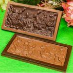 Two chocolate molds sitting on top of a table.