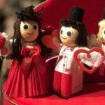 A couple of dolls are on top of the table