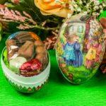 A close up of two decorated eggs on a table