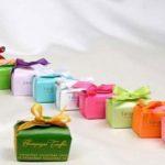 A row of colorful gift boxes with bows on them.