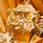 A bouquet of flowers is sitting on top of a box.