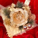 A close up of a flower on top of a red cloth
