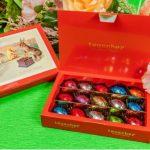 A box of chocolates sitting on top of a table.