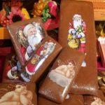 A group of santa clause themed chocolate bars.