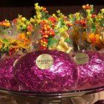 A glass plate with some pink flowers on top of it