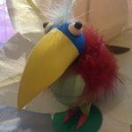 A bird with a beak and feathers on it's head.