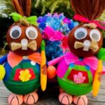 Two brown rabbits with bows and glasses on their heads.