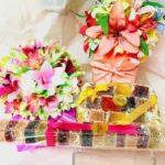 A table with three different types of flowers.