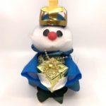 A snowman with a crown on his head