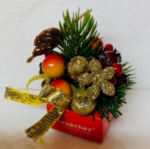 A red box with some gold and green decorations