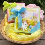 A basket of easter gifts with ribbons and bunny decorations.
