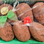 A close up of some brown potatoes wrapped in plastic