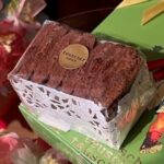 A box of brownies sitting on top of some other boxes.